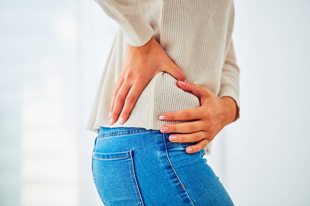 Man holding his knee in pain
